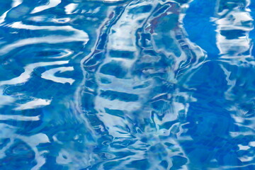 Water abstract background, Swimming pool rippled. Surface of blue swimming pool,background of water in swimming pool. Water background blue. Water reflection.