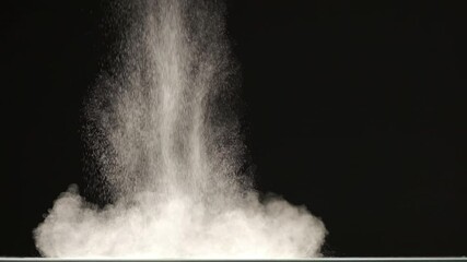 The stream of particles on the black background. slow motion - Powered by Adobe
