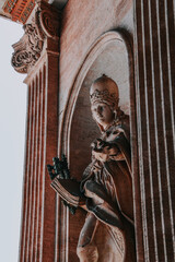 Vertical shot of a statue of a female thought to be the female pope in Vatican City