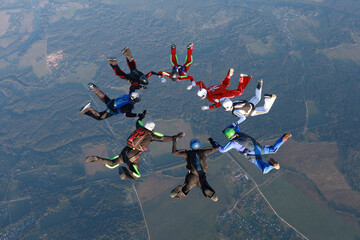 Skydiving.  A team of skydivers is in the sky. © Sky Antonio