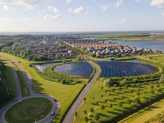 Modern innovative residential area in Almere, along the waterside, including solar panel field. The Netherlands, Flevoland.