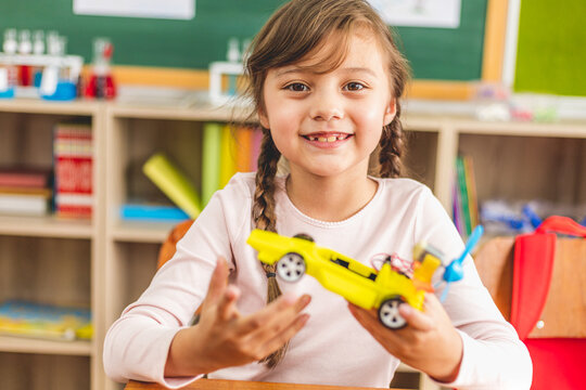 students study programming electric toys at  robotics classroom