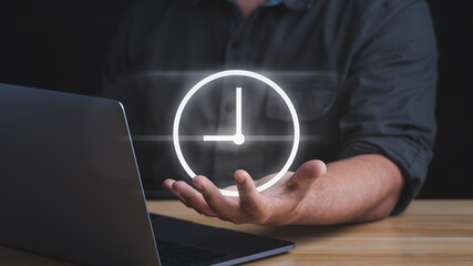 Businessman holding sign clock. Concept of saving time.