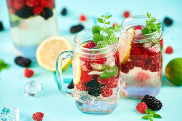 Fresh cocktail in glass jar on green background