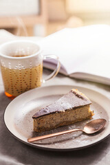 Piece of cake and a mug with hot tea. 
