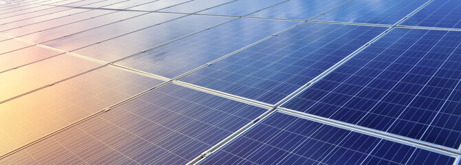 closeup photovoltaic panels which installed on the rooftop of the building, concept for storing and using natural power from the sunlight to care about human environment over the world. - obrazy, fototapety, plakaty