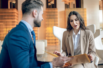 Business partners discussing the project and looking involved