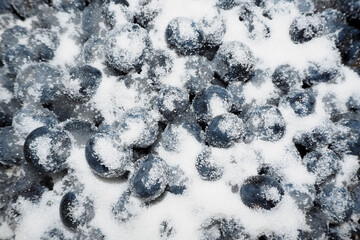 lots of blue blueberries sprinkled with sugar. making jam with blueberries at home