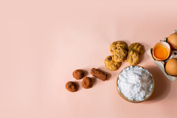 Flour, eggs, cookies, chocolate, preparing food, on the background
