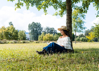 Girl reading a book in the park