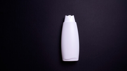 shampoo or hair conditioner bottle isolated on black background