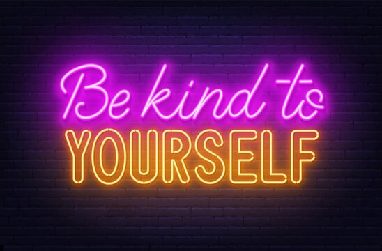 Be kind to yourself neon sign on brick wall background.