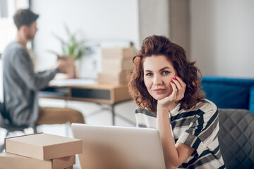 Serene office worker seated at the laptop