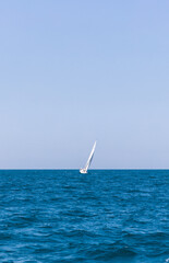 White sailing ship sailing on an angle on the adriatic sea