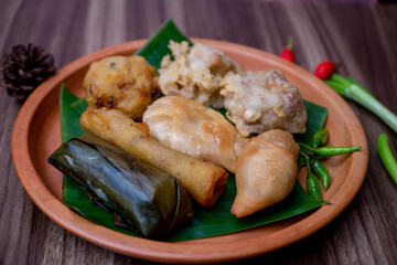 Gorengan is a typical snack from Indonesia. Usually consists of tempeh, tofu, cassava, martabak, and bananas. This food is usually sold by street vendors at cheap prices