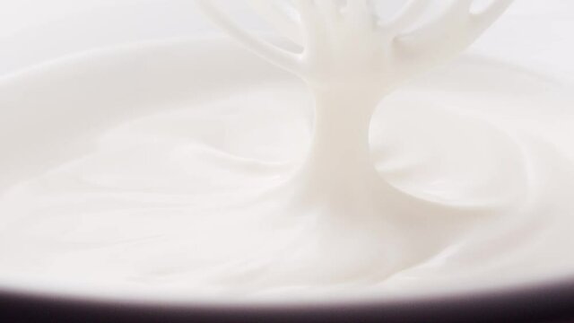 preparation of white cream for dessert with a whisk
