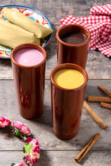 Traditional Mexican atole drink on wooden table