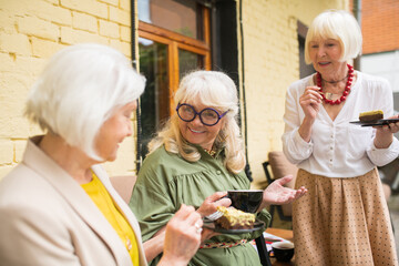 Old friends feeling great while spending time together and drinking tea