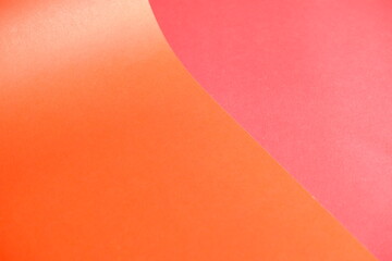 Orange cardboard on a red background. The texture of the cardboard.