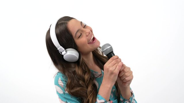 creative realisation of teen girl in music education listen and sing in headphones, vocal school.