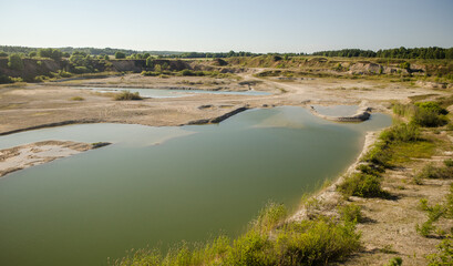 Green water in Vidale village quarry, Latvia.