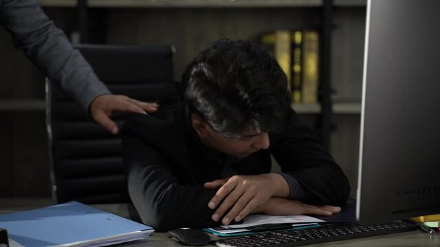 Two businessman discuss a work at night, business person man who working in office over time late, co-worker talking together
