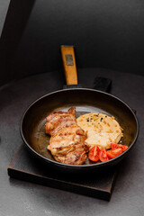 frying pan with chicken