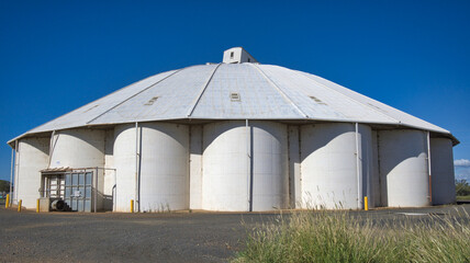 Group of White Grain Silos in a Small Country Town