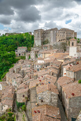 picturesque view of Sorano with old staircase, alley, underpass and plants in the Tuscan medieval village