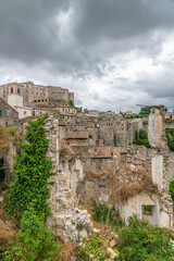 picturesque view of Sorano with old staircase, alley, underpass and plants in the Tuscan medieval village