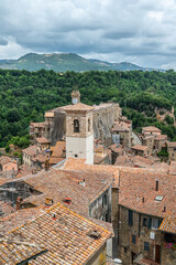picturesque view of Sorano with old staircase, alley, underpass and plants in the Tuscan medieval village