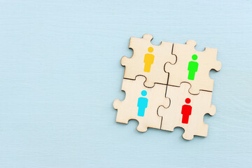business concept image of puzzle blocks with people icons ,human resources and management concept
