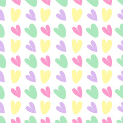 Seamless vector pattern with colored hearts on a white background