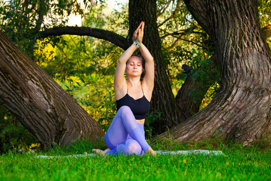 image of woman yoga tree background 
