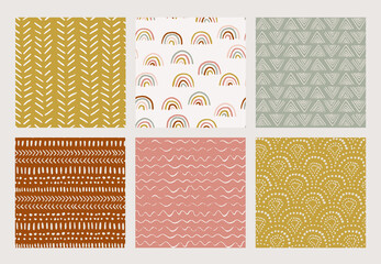 Set of hand-drawn vector abstract brush stroke patterns. Seamless geometric backgrounds. Boho nursery ethnic doodles. Rainbow, stripes, patterns in muted colors.