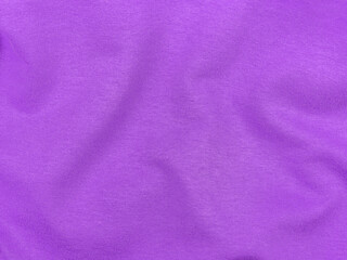 Purple jersey fabric matte texture top view. Violet knitwear satin background. Fashion color feminine clothes trend. Female blog backdrop text sign design. Lilac abstract wallpaper textile surface.
