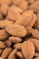 Dried almonds in bulk, close-up on the grain.