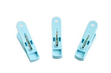 Plastic clothespins in a row isolated on a white background