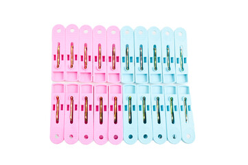 Plastic clothespins in a row isolated on a white background