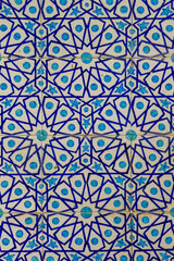 Beautiful traditional floral and geometric pattern on blue and white ceramic tiles on exterior wall of historic Shah Jahan mosque in Thatta, Sindh, Pakistan