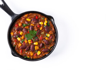 Traditional mexican tex mex chili con carne in iron pan isolated on white background. Top view. Copy space
