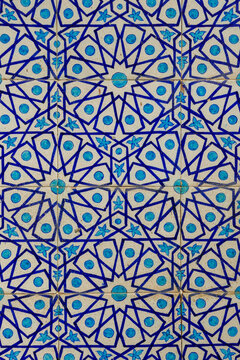 Beautiful traditional floral and geometric pattern on blue and white ceramic tiles on exterior wall of historic Shah Jahan mosque in Thatta, Sindh, Pakistan