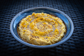 Hummus (or houmous) over blue