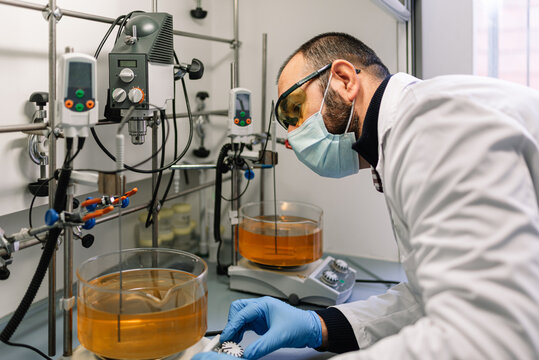 Laboratory Technician Working With Liquids