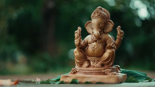 Water splash on lord ganesha sculpture. celebrate lord ganesha festival. 