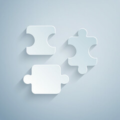 Paper cut Puzzle pieces toy icon isolated on grey background. Paper art style. Vector