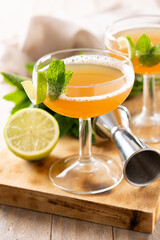 Old Cuban cocktail on wooden table.Alcoholic drink based on rum and champagne