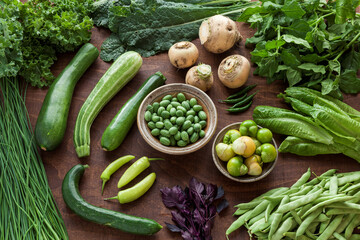 Assortment of organic home-grown vegetables from own garden. Plenty fresh veg of various colors, species and cultivar.
