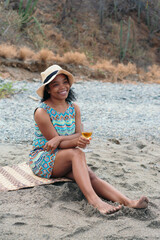 Portrait Of Smiling Beautiful Woman With White Wine At Beach