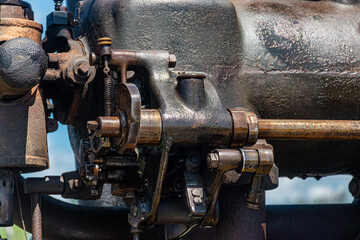 Canandaigua NY Steam Engine Association Pageant of Steam on Saturday, Aug 14, 2021. Close-up of the oil and grease covered antique engine at the show. in Upstate NY.  Antiques on display.